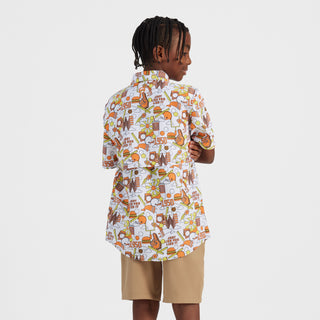 Person wearing a colorful patterned shirt on a white background