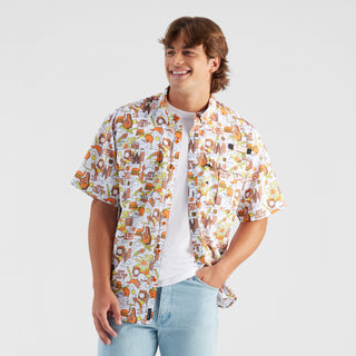 Man wearing a patterned shirt with a white background