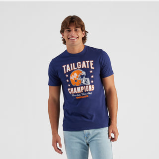 Man wearing a blue t-shirt with 'Tailgate Champions' print on a white background