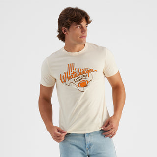 Man wearing a white t-shirt with orange graphics and text on a light gray background