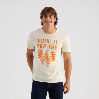 Man wearing a white t-shirt with orange text and logo on a light gray background