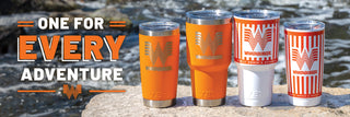View four yeti cups featuring our 20 and 30 ounce king crab orange and our 20 and 30 ounce custom orange and white striped yetis lined up next to a stream. one for every adventure.