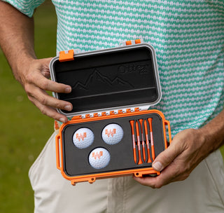 view whataburger dry storage otter box inside. contains three whataburger golf balls and five whataburger golf tees.
