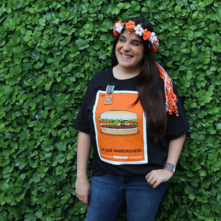 view model standing in front of vines wearing whataburger loteria tee