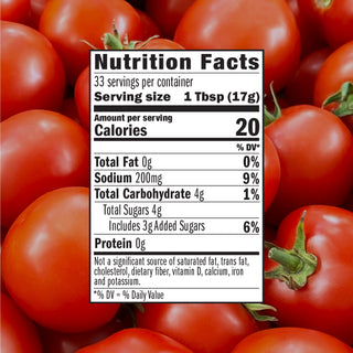 Nutrition facts label for Whataburger Fancy Ketchup over a background of fresh tomatoes.