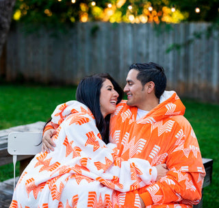 ouple relaxing in a backyard in their whataburger comfy dream and comfy original