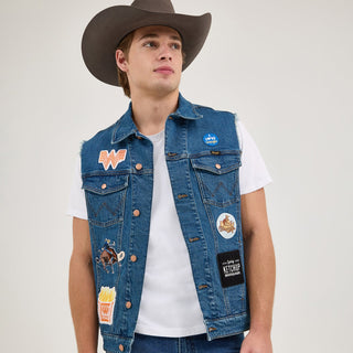 A male model in the Wrangler® x Whataburger® Men's Cut-Off Vest with a cowboy hat – A male model wears the Wrangler® x Whataburger® Men's Cut-Off Vest paired with a white t-shirt, blue jeans, and a brown cowboy hat, capturing a Western-inspired aesthetic.