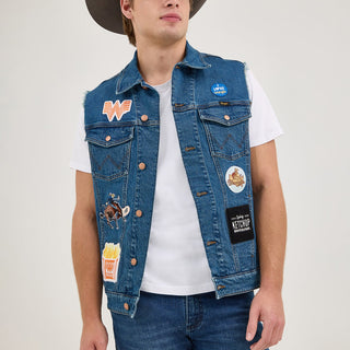 A male model in the Wrangler® x Whataburger® Men's Cut-Off Vest with a cowboy hat – A male model wears the Wrangler® x Whataburger® Men's Cut-Off Vest paired with a white t-shirt, blue jeans, and a brown cowboy hat, capturing a Western-inspired aesthetic.