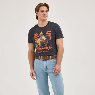 Wrangler® x Whataburger® Long Live Burgers T-Shirt – Mid-Length Front View
The model stands facing the camera, styled with a brown leather Western belt and light-wash Wrangler jeans, wearing the Wrangler® x Whataburger® Long Live Burgers T-Shirt. The Flying W Whataburger logo and cowboy bronco design are prominently displayed on the chest.