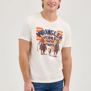 Smiling Front View: The male model smiles while wearing the Wrangler® x Whataburger® White Graphic T-Shirt. The relaxed fit and soft fabric give it a comfortable, classic Western appeal.