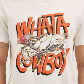 A close-up of the front of the Wrangler® x Whataburger® Cowboy Graphic White T-Shirt, showing the distressed-style graphic of a bucking bronco and a cowboy with "WHATA COWBOY" in bold orange letters.