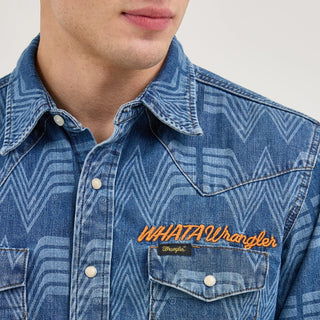 Close-up of the chest details on the Wrangler® x Whataburger® Men's Western Print Shirt – A detailed view of the shirt’s pearl snap buttons, "WHATAWrangler" embroidered branding, and Wrangler® logo tag above the left chest pocket.