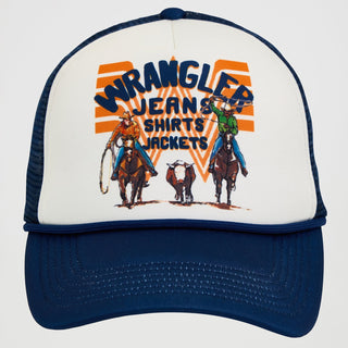 A straight-on view of the Wrangler® x Whataburger® Foam Navy Trucker Hat, showcasing a white foam front panel with a vintage-inspired graphic of two cowboys on horseback and a cattle dog, along with bold navy text that reads "WRANGLER JEANS SHIRTS JACKETS." The background features the classic Whataburger orange "W" stripes.