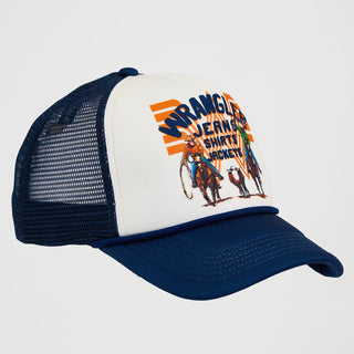 A side-angled view of the Wrangler® x Whataburger® Foam Navy Trucker Hat, showing the white front panel, the Wrangler x Whataburger cowboy graphic, and the navy mesh backing. The hat's bill is structured, with a slight curve. A small orange "WHATAWrangler" patch is stitched onto the side mesh panel.