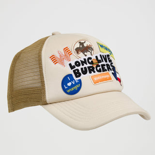 Side view of the Wrangler® x Whataburger® Long Live Burgers Patch Trucker Hat – A three-quarter angle shot of the trucker hat, highlighting the details of the embroidered patches and the beige fabric front panel. The side mesh panel is visible, along with an orange "WHATAWrangler" label sewn onto the brim.