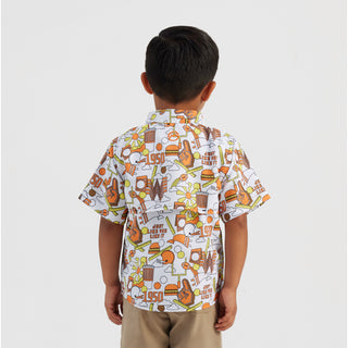 Child wearing a colorful patterned shirt on a white background