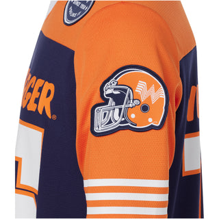 Close-up of an orange and navy sports jersey with a helmet logo and 'Winger' branding.