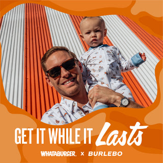 Smiling father holding child in matching Whataburger x Burlebo outfits, standing in front of a striped wall with overlay text promoting limited-time availability.