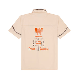 Beige shirt with Whataburger logo and text on the back