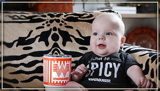 View baby with Whataburger Spicy Onesie on and Whataburger YETI. Reads For The Small Fry.