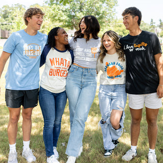 View group of men and women wearing assorted Whataburger tees