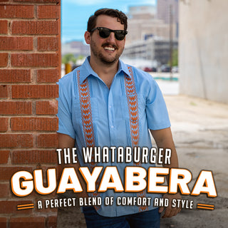 View man in whataburger light blue guayabera. Reads the Whataburger Guayabera. A perfect blend of comfort and style.