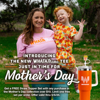 View woman wearing WhataMama tee and holding child in arms. Reads Introducing the new WhataMama Tee just in time for Mother's Day. Get a free straw topper set with any purchase in the Mother's Day collection over $10. Limit one free set per order. Offer valid thru 5/5/24.