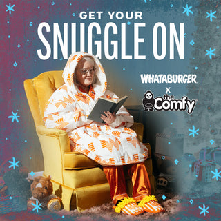 View woman sitting in Whataburger Comfy Teddy Bear Full Zip reading book with Whataburger Fry Slippers. Reads Get Your Snuggle On. Whataburger x the Comfy.