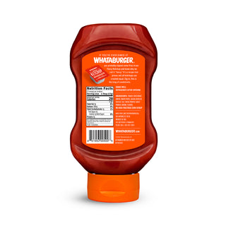 Squeeze bottle of Whataburger ketchup on a white background