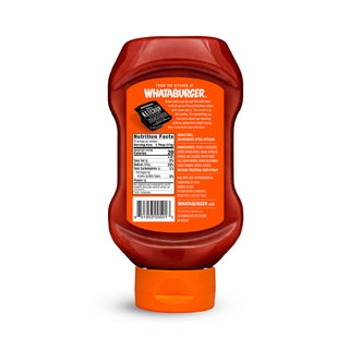 Squeeze bottle of Whataburger ketchup on a white background