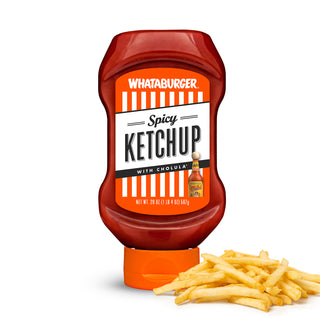 Whataburger Spicy Ketchup bottle with a pile of fries on a white background