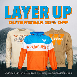 A winter-themed graphic featuring a snowy forest background. The text "Layer Up" is displayed in bold blue and orange letters, followed by "Outerwear 20% Off" in orange. To the right, there is a gray Whataburger sweatshirt and a colorful blue, white, and orange Whataburger windbreaker. The design promotes a winter outerwear sale.