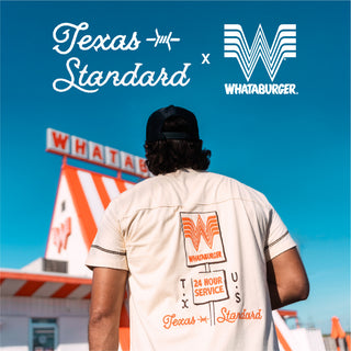 Person wearing a branded shirt with Whataburger and Texas Standard logos, standing in front of a Whataburger restaurant.