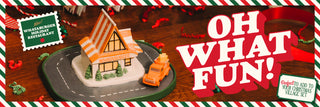 Christmas-themed gingerbread village with a toy car and candy cane decorations.