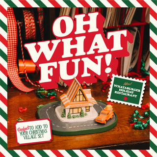 Christmas-themed display with a small house and car model, surrounded by festive decorations and text 'OH WHAT FUN!'.