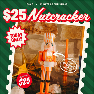 Nutcracker toy with promotional text for a sale on a green and red striped background