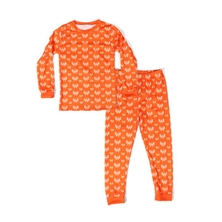 Orange youth pajama set with white Whataburger pattern on a white background