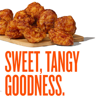 Whatawings on a wooden board with 'Sweet, Tangy Goodness' text.