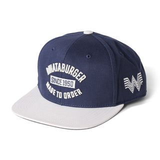 Navy and white cap with branding on a white background