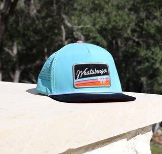 view retro aqua staunch hat on limestone with trees in the background.