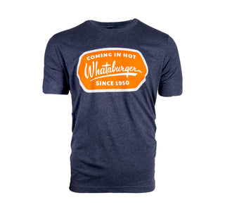 View navy tee shirt, with an orange graphic that reads, Whataburger coming in hot since 1950. written in white font.