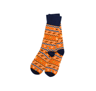 View Orange, white, and blue zig zag sock. Design features a burger, ornaments, fries, and snowflakes.