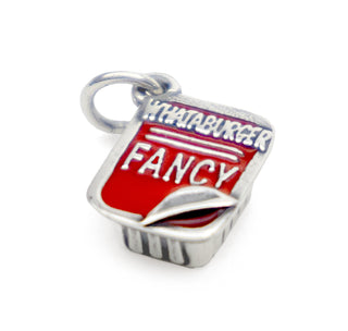 View Whataburger Fancy Ketchup James Avery charm with the corner peeled up to reveal the ketchup hiding inside.