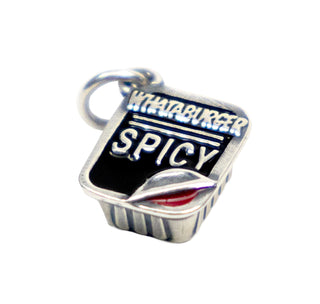 View Whataburger Spicy Ketchup James Avery charm with the corner peeled up to reveal the ketchup hiding inside.
