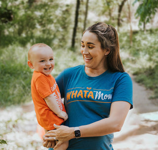 view mother and son smiling in a park wearing whatamom t-shirt and raised on t-shirt.